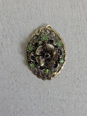 Gold-Tone Floral Pendant with Green Stones